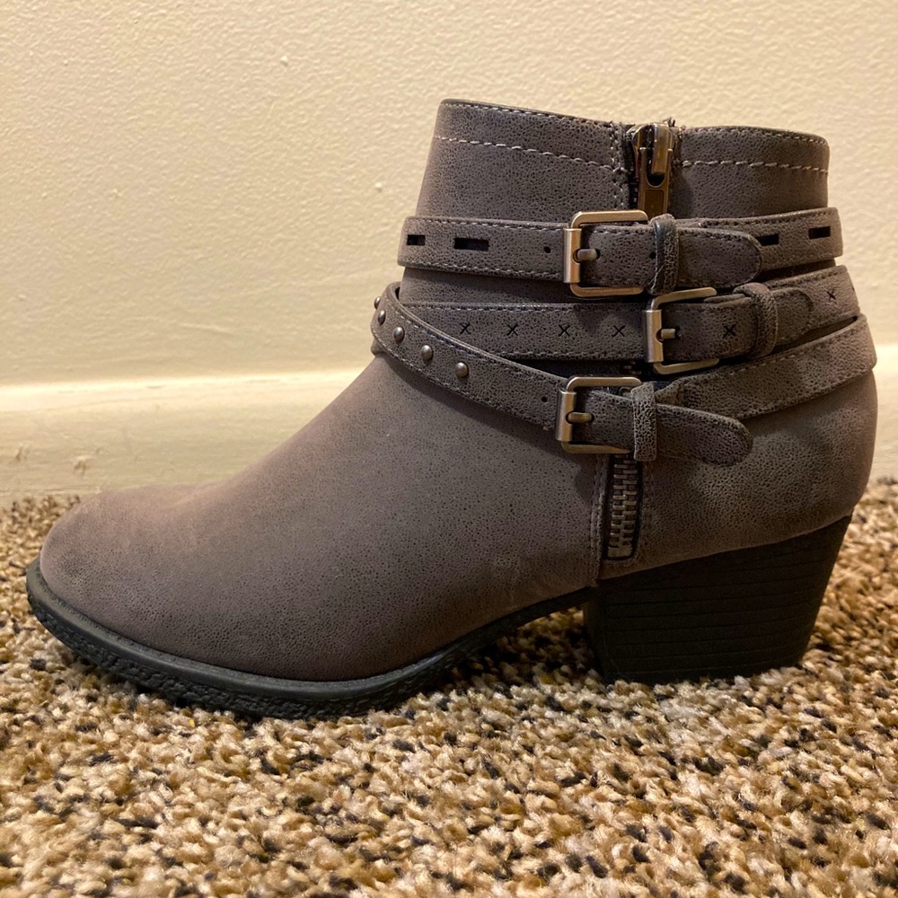 Grey heeled boots with zippers and buckles